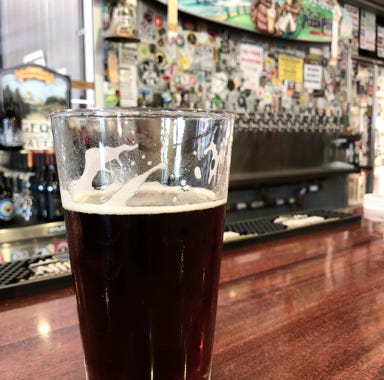 Unrecognizable men clinking glasses of beer